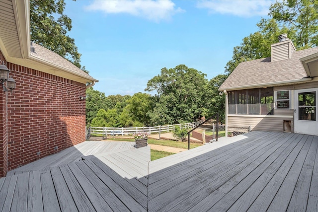 15355 Pleasant Grove Ln, Harrisburg, AR 72432 - wooden terrace with a sunroom and a fenced backyard