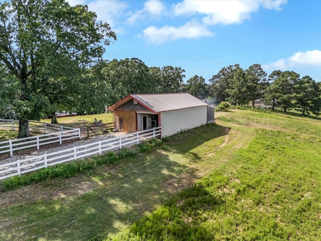 15355 Pleasant Grove Ln, Harrisburg, AR 72432 - view of property exterior featuring an exterior structure, an outdoor structure, and a metal roof