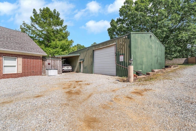 15355 Pleasant Grove Ln, Harrisburg, AR 72432 - garage featuring driveway and a garage