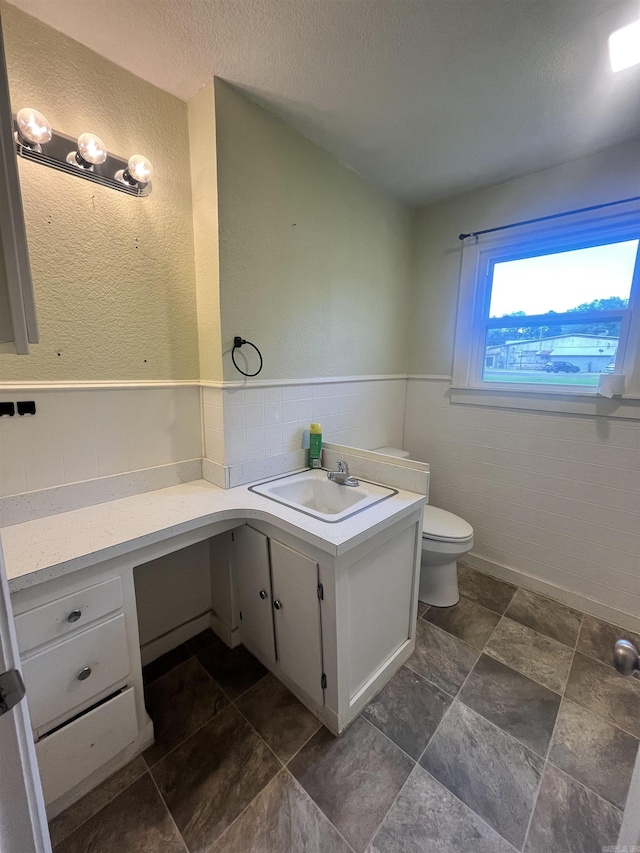 1505 W Park Ave, Searcy, AR 72143 - half bathroom with vanity, wainscoting, and a textured ceiling