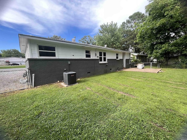 1505 W Park Ave, Searcy, AR 72143 - back of property with brick siding, crawl space, and a patio