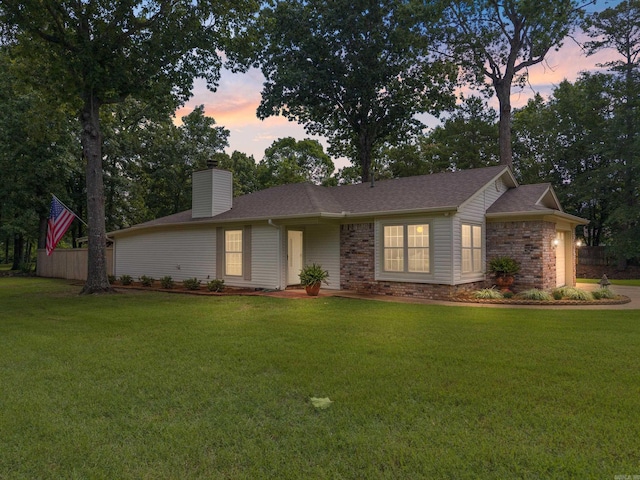 101 Rolling Oaks Dr, Maumelle, AR 72113 - ranch-style home featuring a chimney, a front yard, and a garage