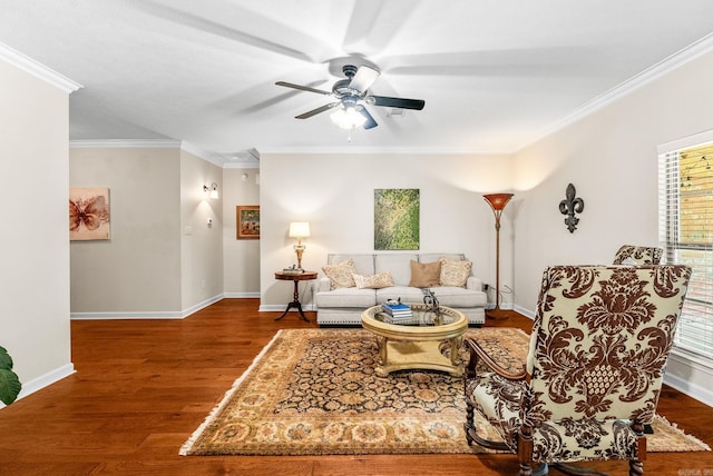living room featuring wood finished floors, crown molding, and ceiling fan