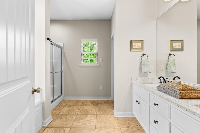 full bathroom with vanity and an enclosed shower