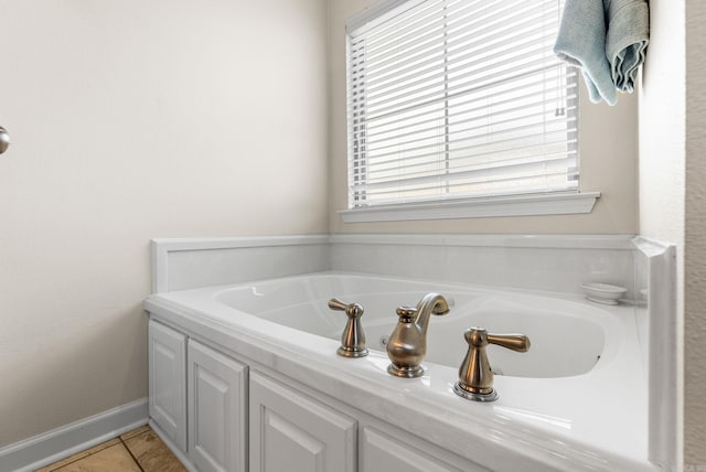 full bathroom with a garden tub and tile patterned floors