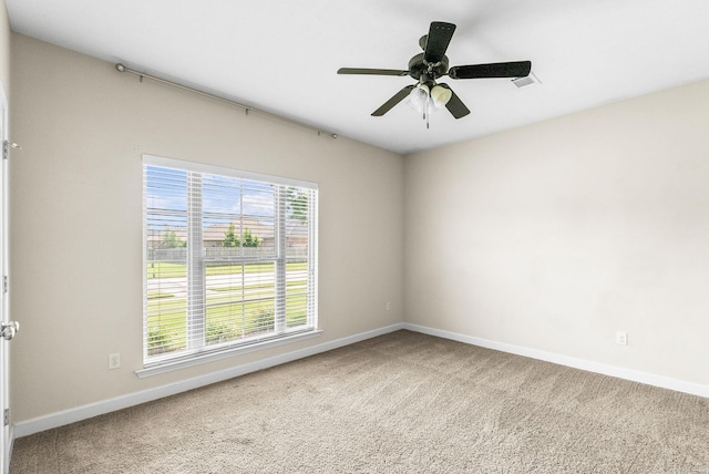 unfurnished room featuring carpet flooring and ceiling fan
