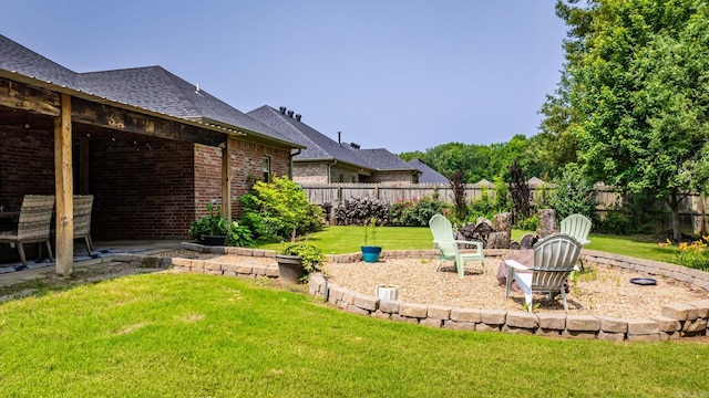 fenced backyard featuring an outdoor fire pit