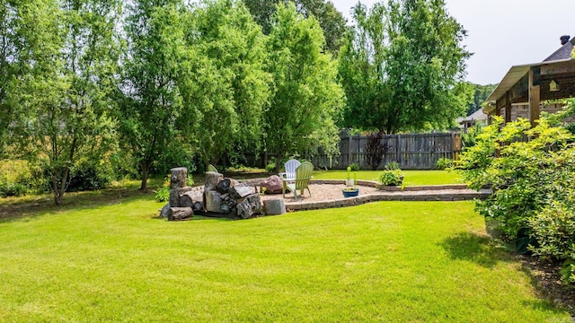 view of yard with an outdoor fire pit