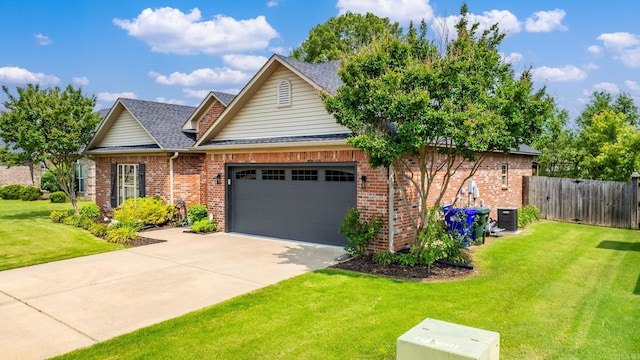 traditional-style house featuring an attached garage, concrete driveway, roof with shingles, and brick siding