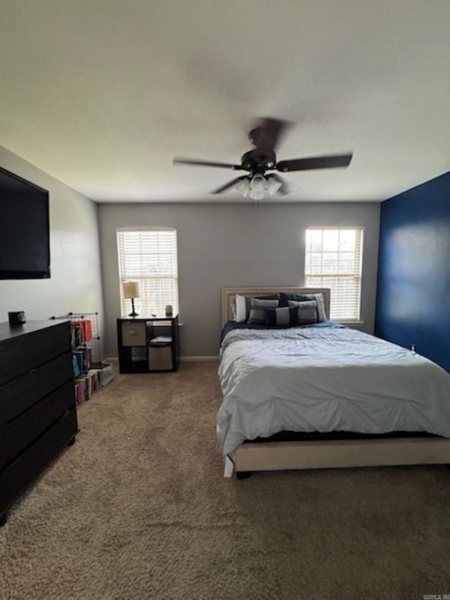 bedroom with multiple windows, carpet, and a ceiling fan