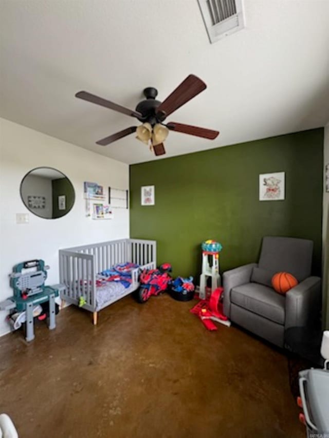 bedroom with concrete floors and ceiling fan