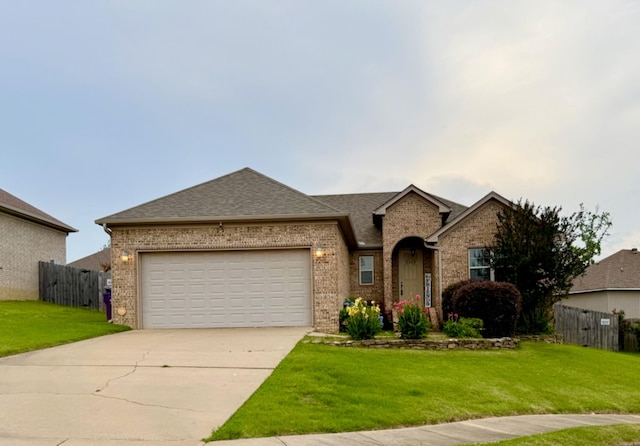 view of front of home with brick siding, driveway, a garage, and roof with shingles