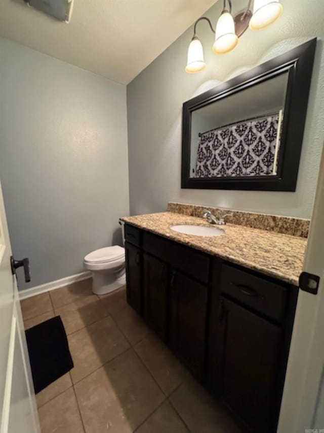 full bath featuring vanity and tile patterned floors
