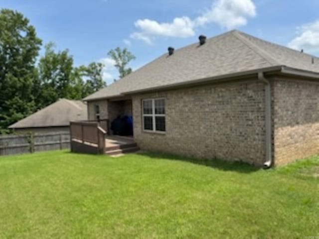 back of house featuring a deck