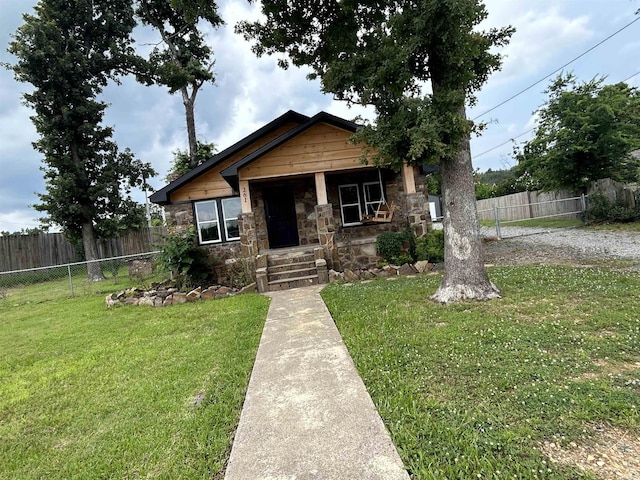 261 E Military, North Little Rock, AR 72118 - view of front facade featuring stone siding and a porch