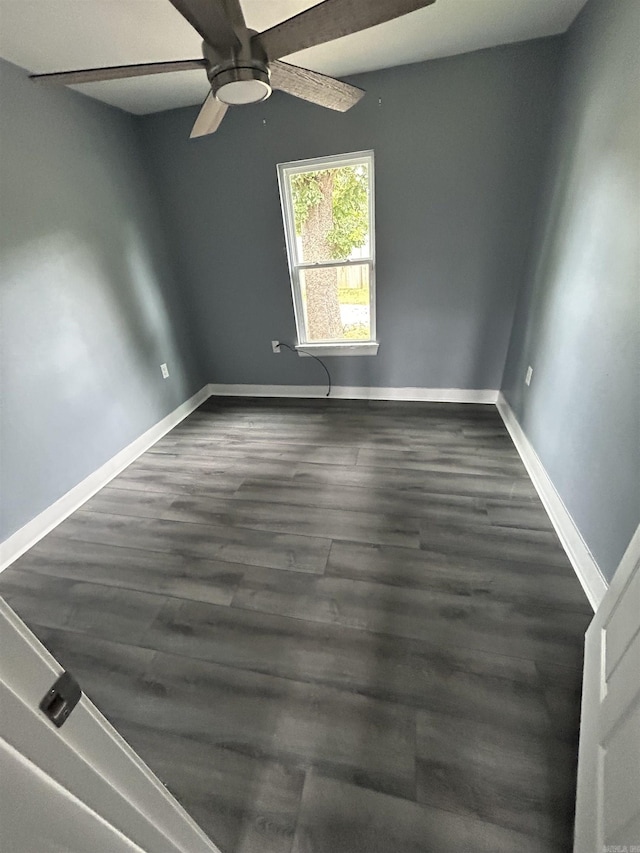 261 E Military, North Little Rock, AR 72118 - empty room featuring a ceiling fan and dark wood-type flooring