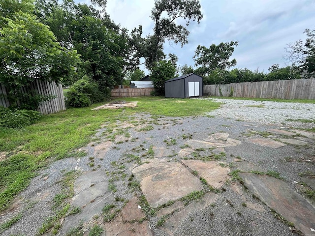 261 E Military, North Little Rock, AR 72118 - fenced backyard featuring a storage shed