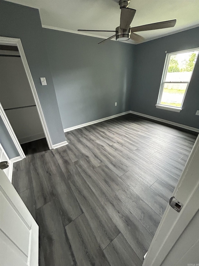 261 E Military, North Little Rock, AR 72118 - empty room featuring a ceiling fan and dark wood finished floors