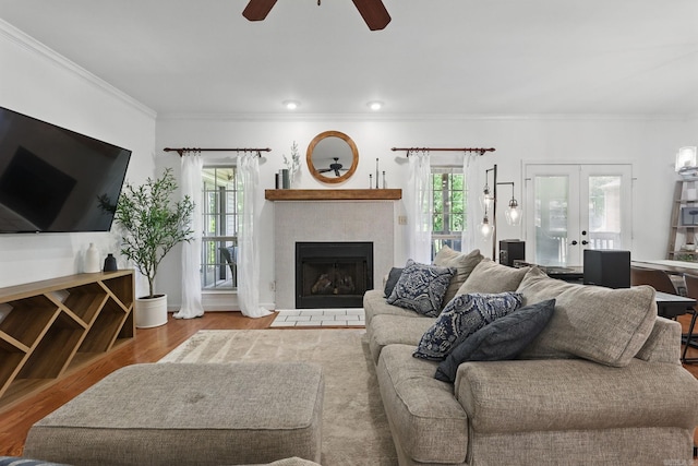 2716 Juniper Dr, Benton, AR 72015 - living room featuring a ceiling fan, french doors, crown molding, a fireplace, and wood finished floors