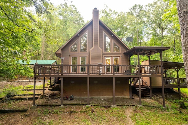 232 Alydar Trl, Hot Springs, AR 71901 - back of house featuring a deck, stairway, and a chimney