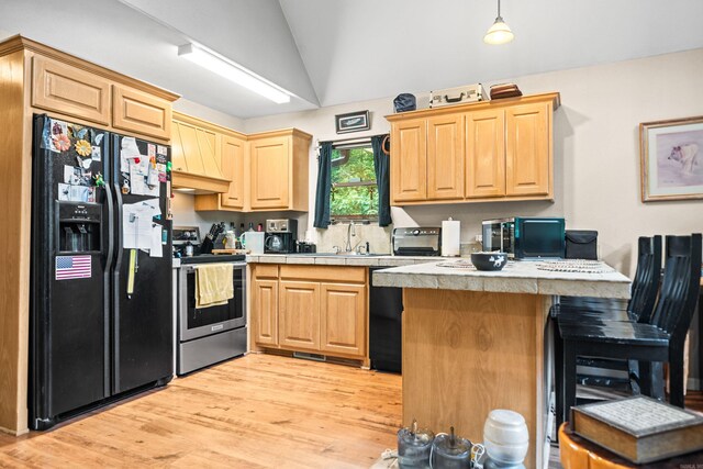 232 Alydar Trl, Hot Springs, AR 71901 - kitchen with black appliances, lofted ceiling, premium range hood, a peninsula, and light countertops