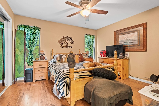 232 Alydar Trl, Hot Springs, AR 71901 - bedroom with wood finished floors, multiple windows, and a ceiling fan
