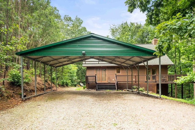 232 Alydar Trl, Hot Springs, AR 71901 - view of front facade with a detached carport, a chimney, driveway, and a deck
