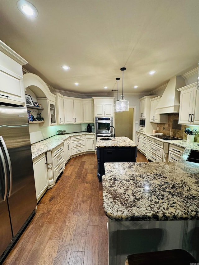 350 Wellesley, Conway, AR 72034 - kitchen with premium range hood, appliances with stainless steel finishes, dark wood finished floors, light stone counters, and recessed lighting
