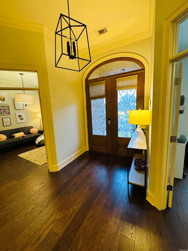 350 Wellesley, Conway, AR 72034 - entrance foyer with dark wood-style flooring, french doors, a chandelier, and crown molding