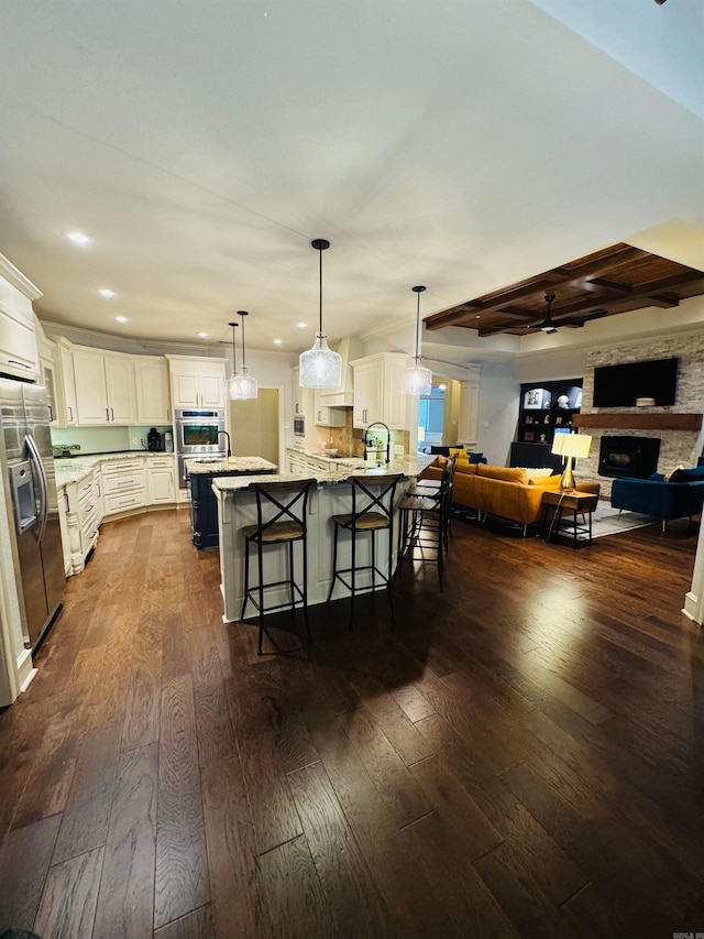 350 Wellesley, Conway, AR 72034 - kitchen with stainless steel fridge with ice dispenser, dark wood-style floors, a breakfast bar, recessed lighting, and open floor plan