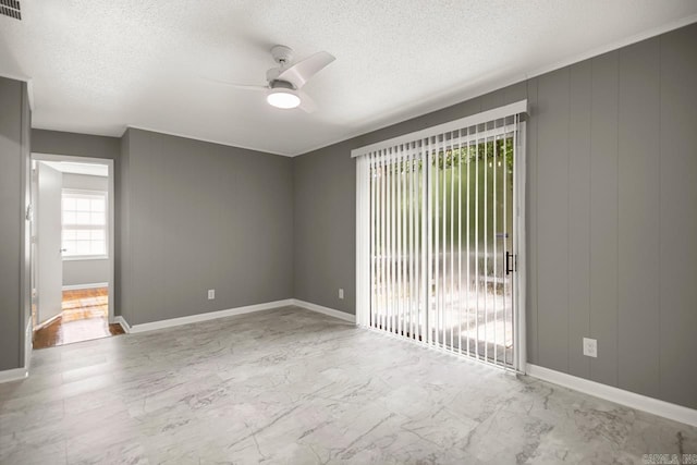 2911 Wynne Dr, Little Rock, AR 72204 - spare room with ceiling fan, a textured ceiling, and marble finish flooring