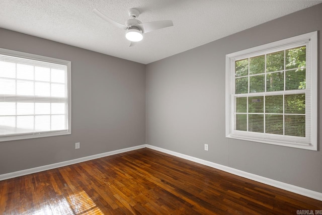 2911 Wynne Dr, Little Rock, AR 72204 - spare room featuring dark wood-style floors, ceiling fan, and a textured ceiling