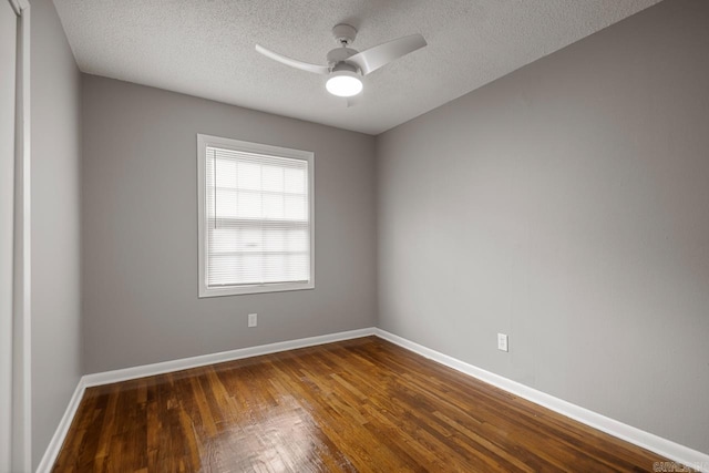 2911 Wynne Dr, Little Rock, AR 72204 - empty room with dark wood-style flooring, a ceiling fan, and a textured ceiling