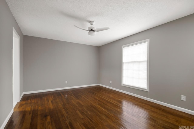 2911 Wynne Dr, Little Rock, AR 72204 - unfurnished room with dark wood-type flooring, ceiling fan, and a textured ceiling