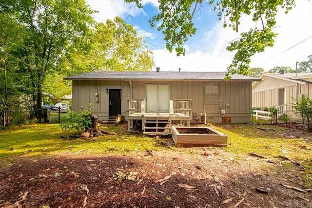 2911 Wynne Dr, Little Rock, AR 72204 - rear view of house featuring a deck, board and batten siding, and a shingled roof