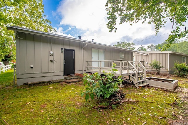 2911 Wynne Dr, Little Rock, AR 72204 - rear view of house featuring board and batten siding and a deck