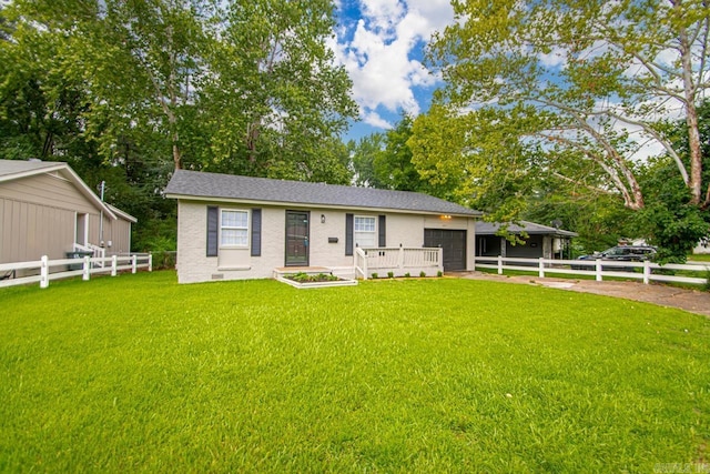 2911 Wynne Dr, Little Rock, AR 72204 - ranch-style house featuring concrete driveway, an attached garage, and view of wooded area