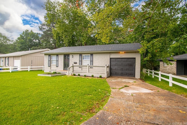 2911 Wynne Dr, Little Rock, AR 72204 - view of front of home with concrete driveway, an attached garage, and brick siding