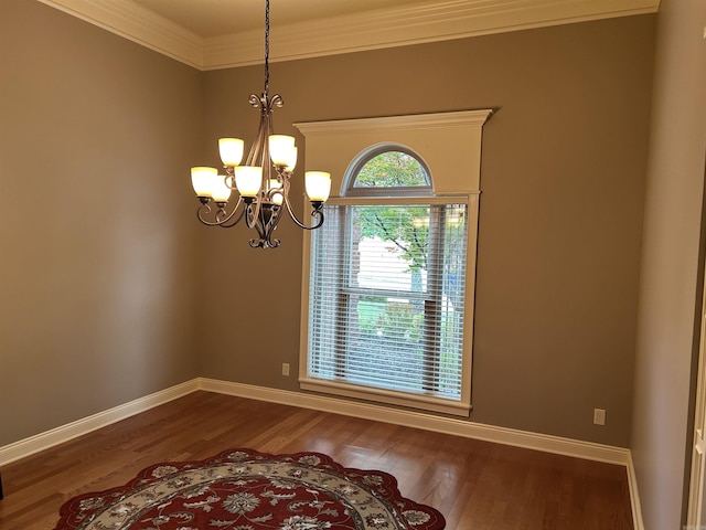 2205 Vermont St, Conway, AR 72034 - empty room featuring crown molding, a chandelier, and wood finished floors