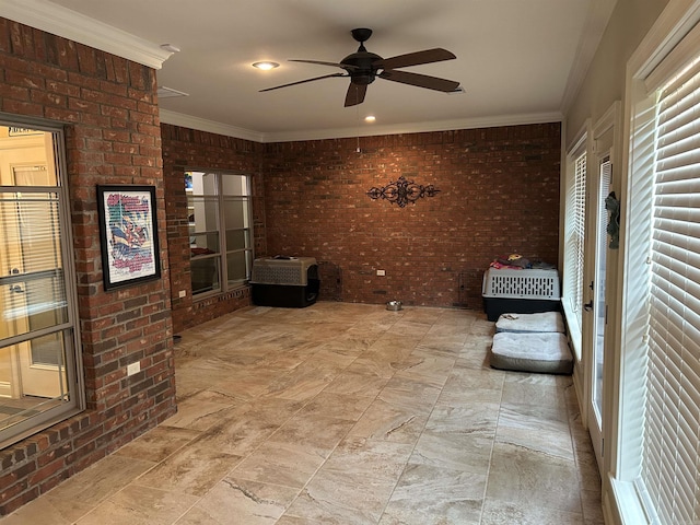 2205 Vermont St, Conway, AR 72034 - unfurnished room with ceiling fan, brick wall, and ornamental molding