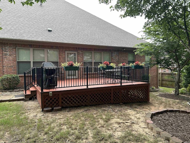 2205 Vermont St, Conway, AR 72034 - rear view of house featuring brick siding, roof with shingles, and a wooden deck