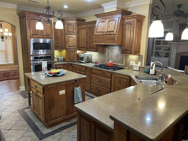 2205 Vermont St, Conway, AR 72034 - kitchen with stainless steel appliances, a chandelier, crown molding, inlaid floor details, and backsplash