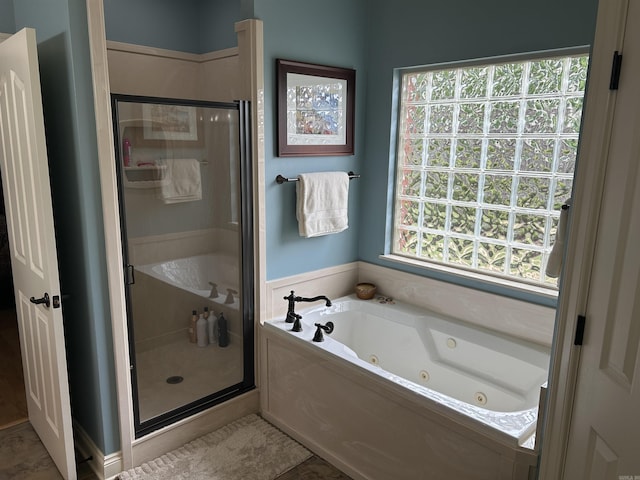 2205 Vermont St, Conway, AR 72034 - bathroom featuring a stall shower and a tub with jets