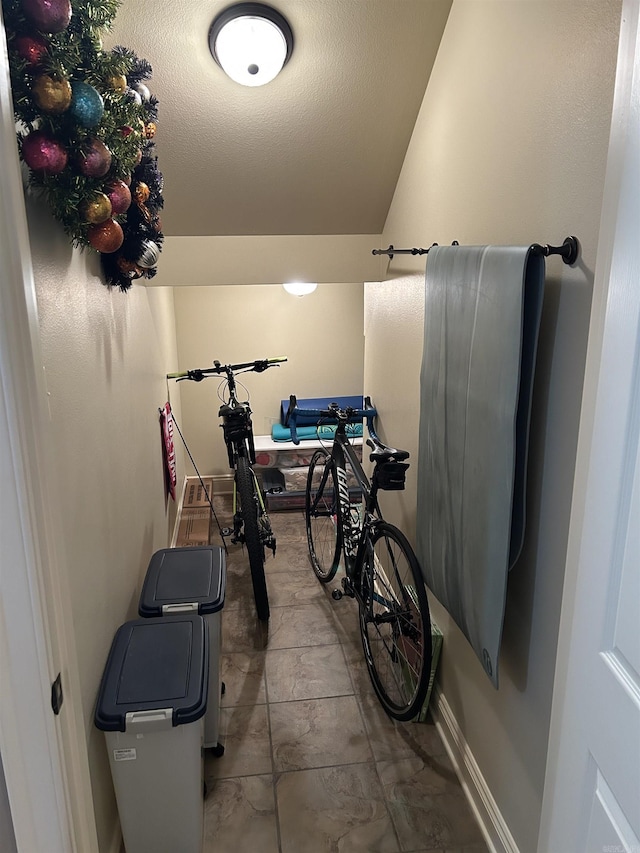 2205 Vermont St, Conway, AR 72034 - workout area featuring lofted ceiling and baseboards
