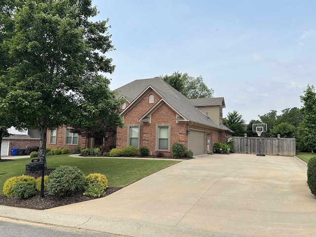 2205 Vermont St, Conway, AR 72034 - view of front of property featuring brick siding, concrete driveway, a garage, and a shingled roof