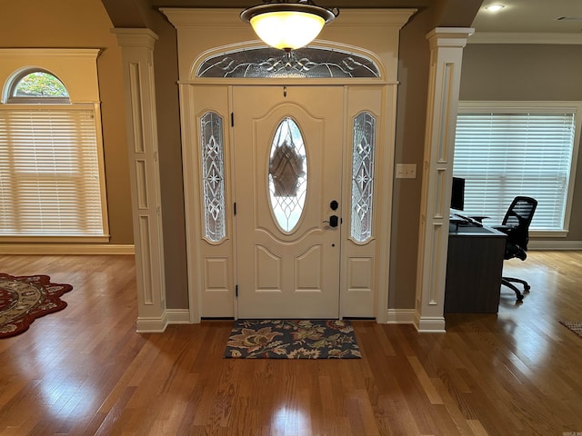 2205 Vermont St, Conway, AR 72034 - entrance foyer featuring ornate columns, wood finished floors, and crown molding