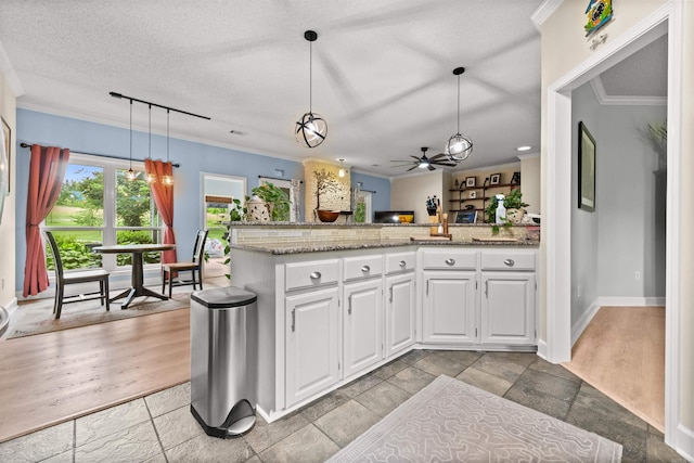 113 Friendship Ln, Beebe, AR 72012 - kitchen featuring ornamental molding, white cabinetry, hanging light fixtures, light stone countertops, and ceiling fan