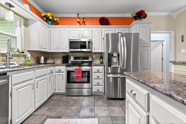 113 Friendship Ln, Beebe, AR 72012 - kitchen featuring stainless steel appliances, white cabinetry, tasteful backsplash, and ornamental molding