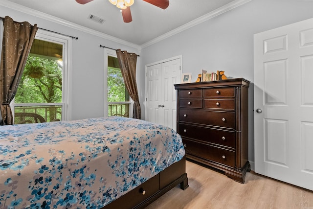 113 Friendship Ln, Beebe, AR 72012 - bedroom with light wood-type flooring, crown molding, a closet, and ceiling fan