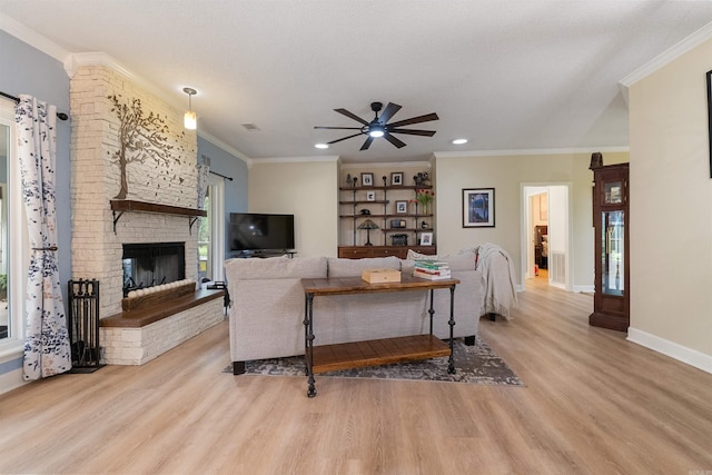 113 Friendship Ln, Beebe, AR 72012 - living room with wood finished floors, ceiling fan, ornamental molding, recessed lighting, and a fireplace